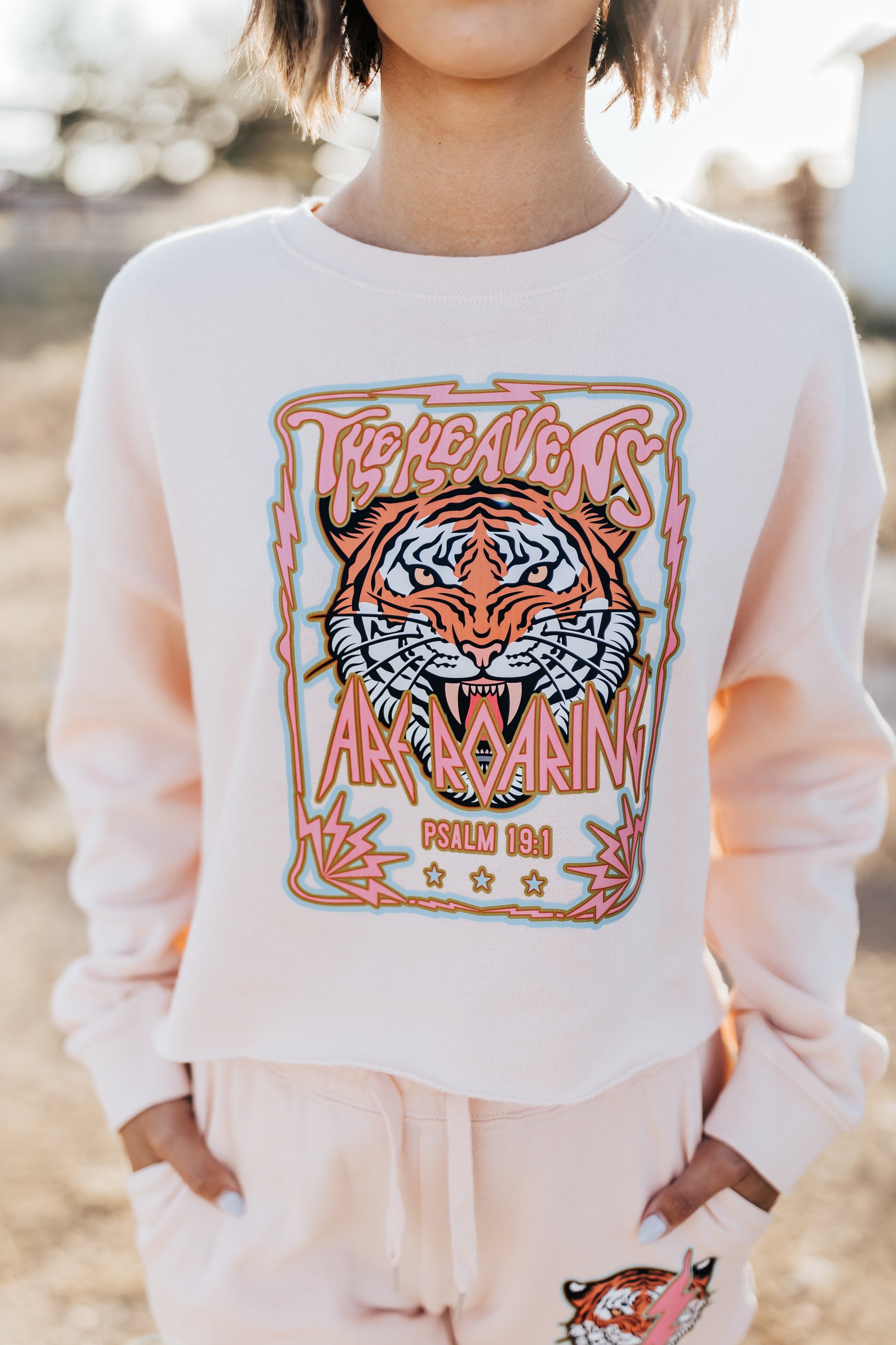 THE HEAVENS ARE ROARING SWEATSHIRT