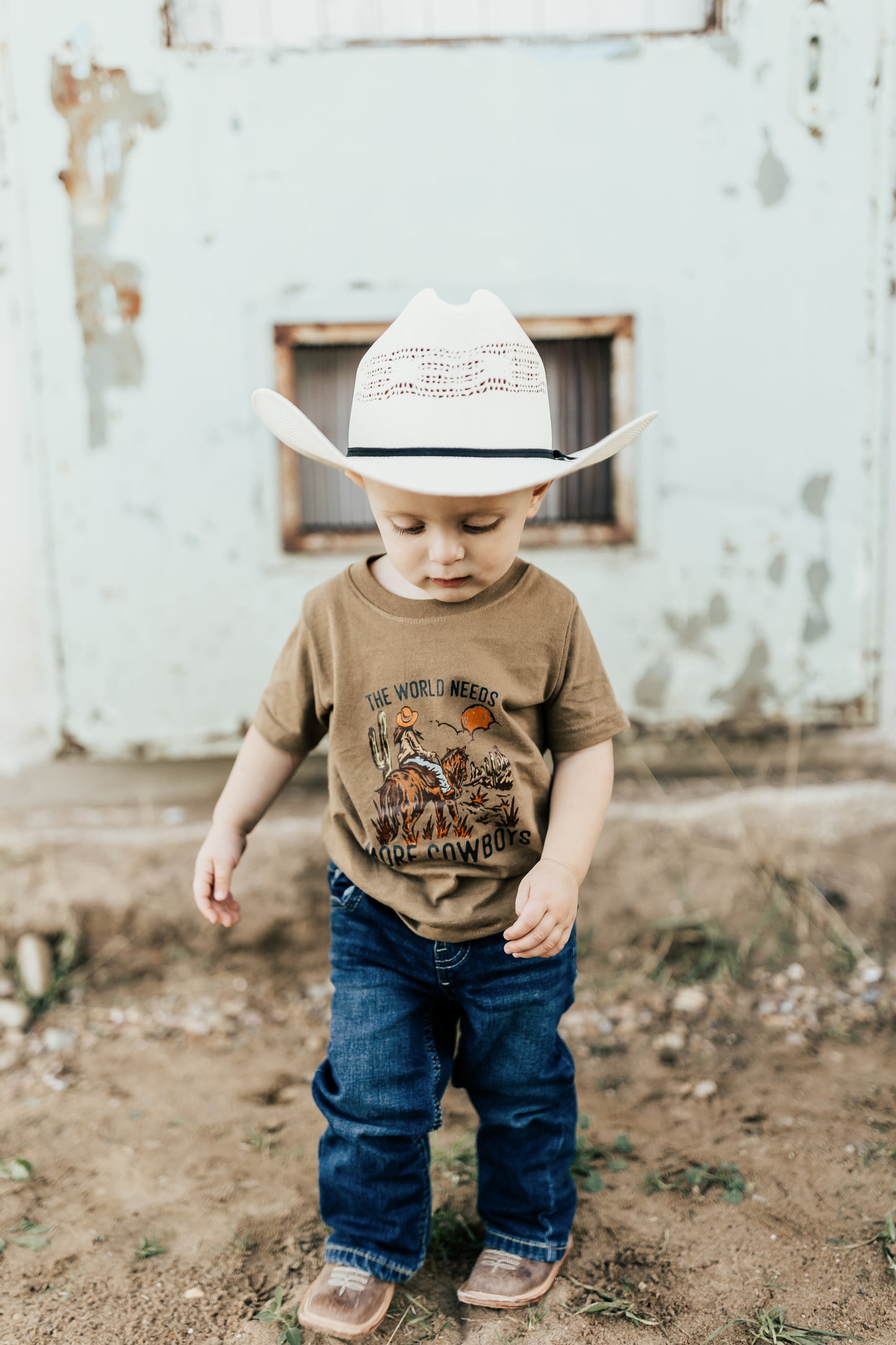 THE WORLD NEEDS MORE COWBOYS TEE