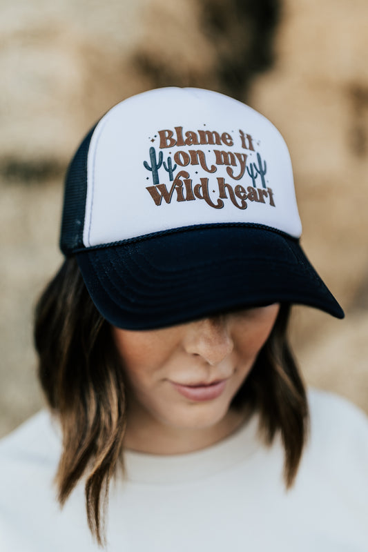 BLAME IT ON MY WILD HEART TRUCKER HAT